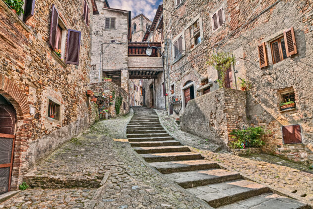 picturesque old narrow alley with staircase in the medieval village Anghiari, province of Arezzo, Tuscany, Italy
